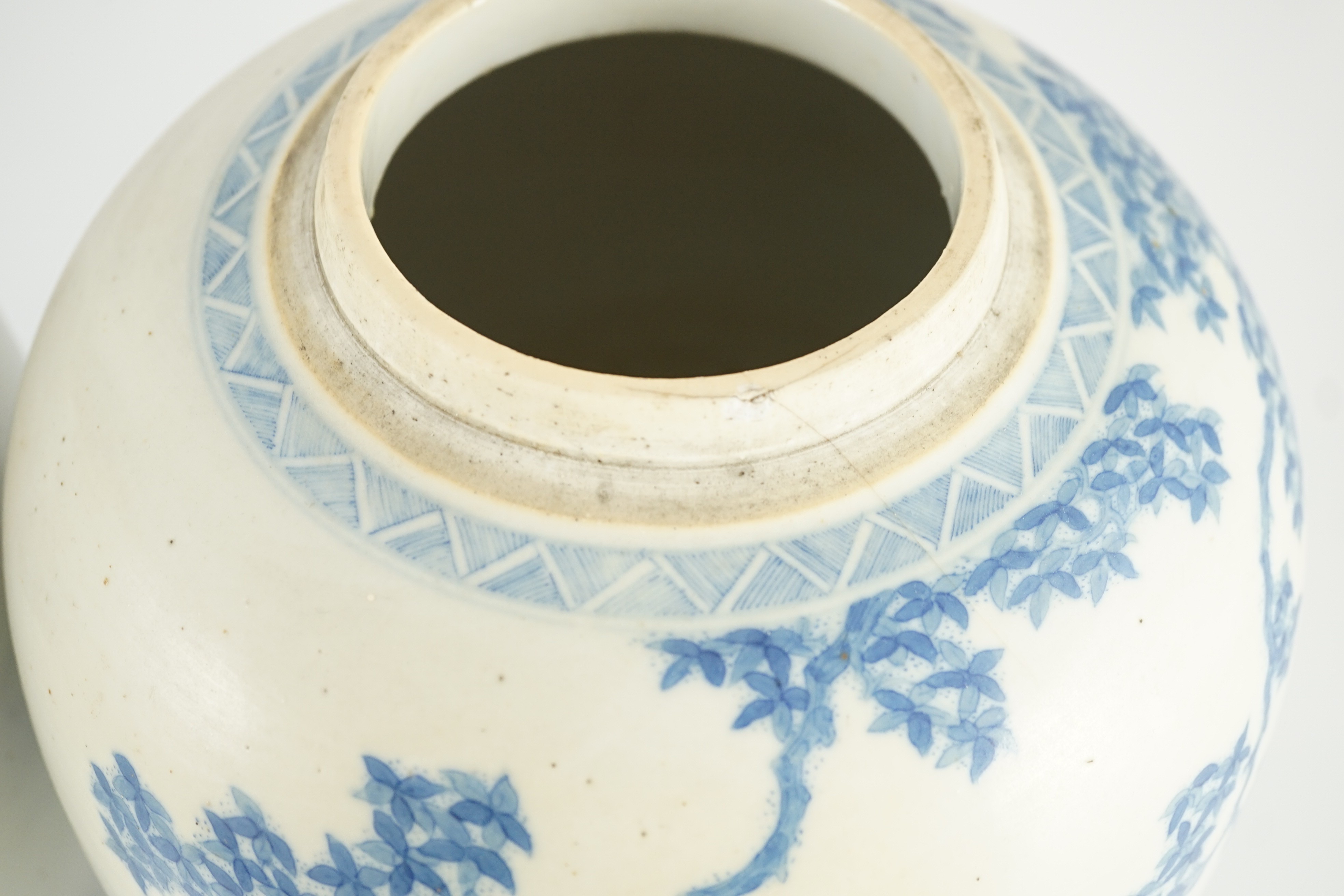 A pair of large Chinese blue and white ovoid jars and associated covers, 19th century, 34.5cm high, damage and repairs